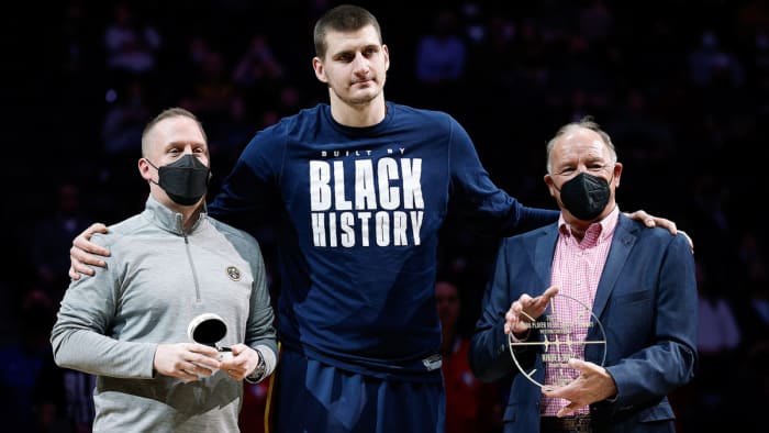 Denver Nuggets center Nikola Jokic (C) is presented with an NBA All-Star ring from Nuggets president Tim Connelly.